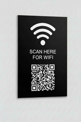 Black sign with WiFi symbol and QR code on a white background